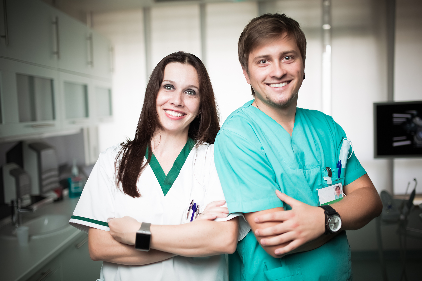 Young experienced doctors dentists standing along with nurse ass